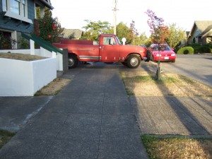 Red truck blocking sidewalk